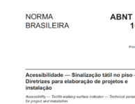 imagem de tela da capa da nova norma sobre pisos táteis - fundo branco e letra preta com o tema da norma e número. Aparece em destaque "norma brasileira".